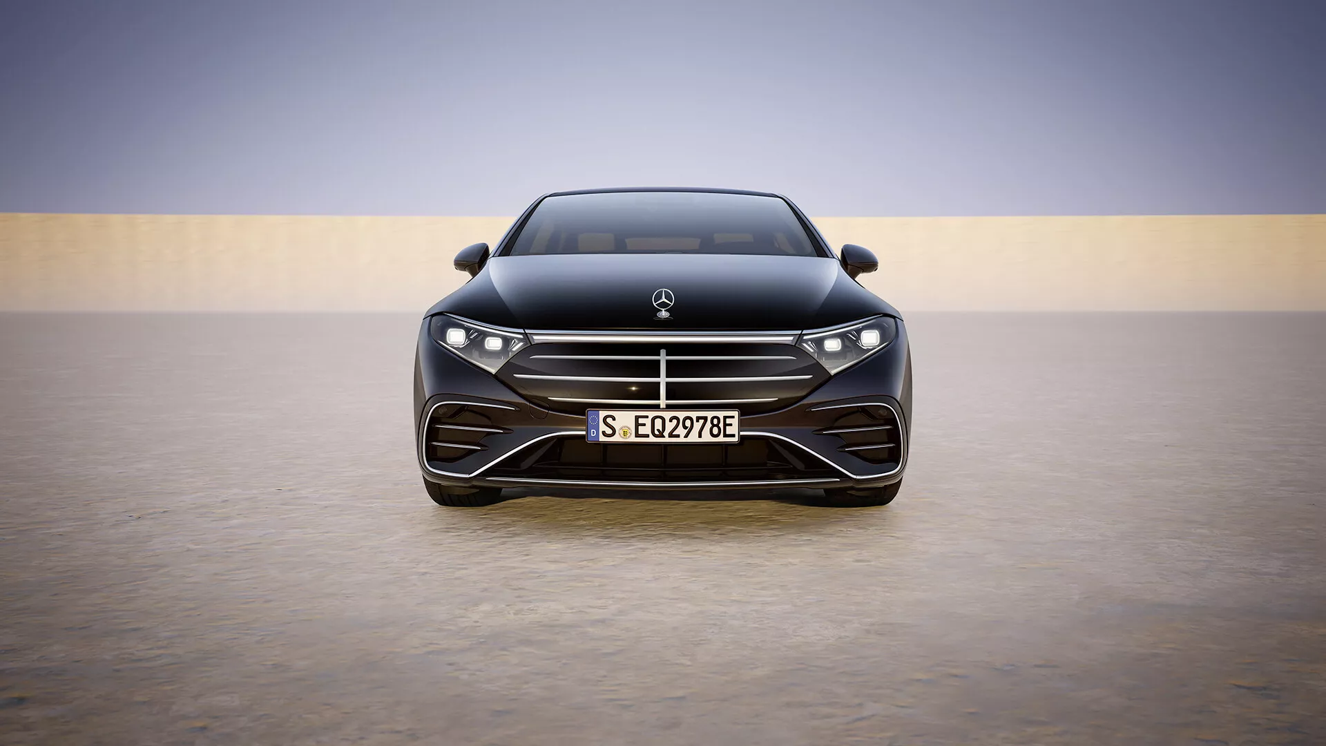 Modelo renovado de Mercedes-Benz EQS 2024 mostrando una vista frontal completa impresionante con su capó elegante, rejilla prominente con listones horizontales, faros LED avanzados y entrada de aire inferior orientada al rendimiento, contra un fondo degradado simplista que destaca el lujo y la tecnología moderna.